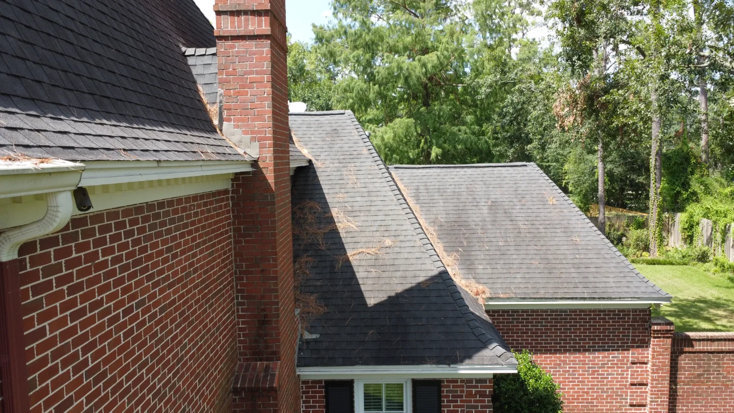 After: the same roof with new shingles installed by TMS Roofing