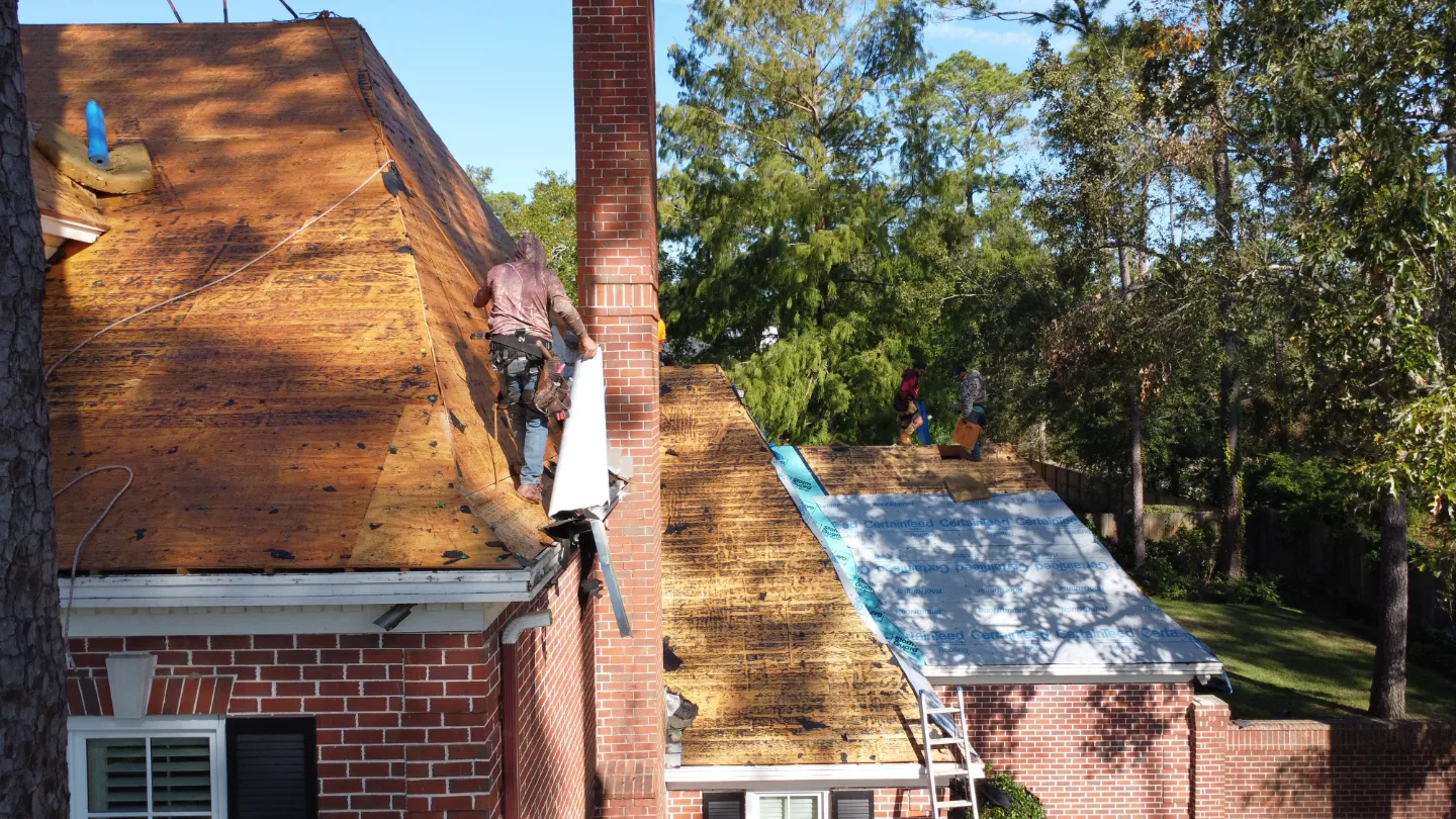 Before: roof decking exposed during tear-off